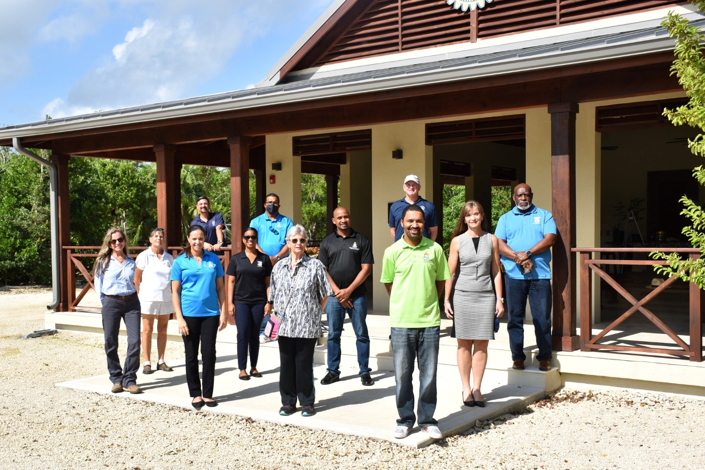 National Tree Planting Committee members and civil servants for the ministry of sustainability climate resiliency and wellness (MSCRW)  the Cayman Islands pose for a picture